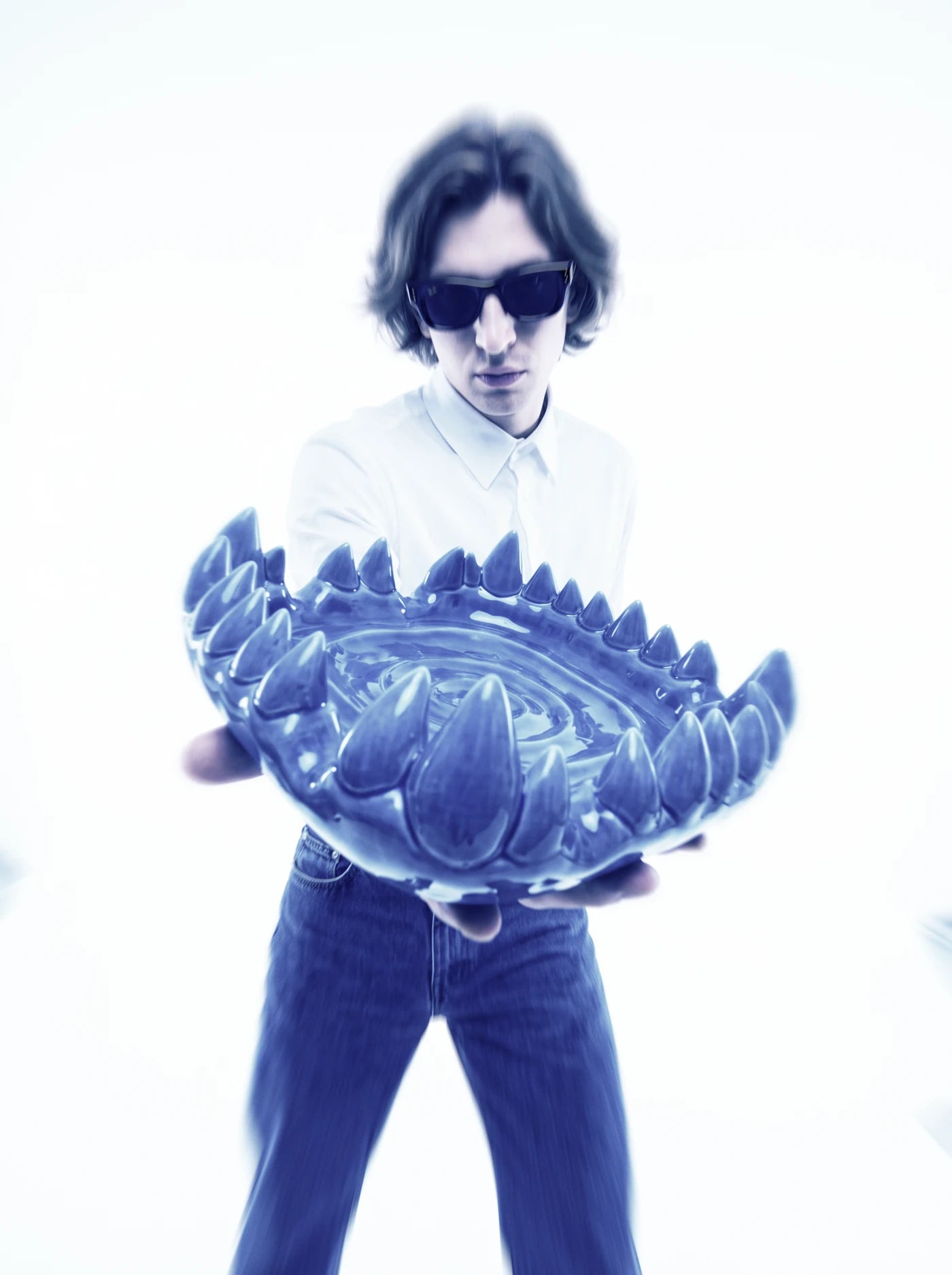 Rude and Sharp editorial portrait with a sculptural blue tray