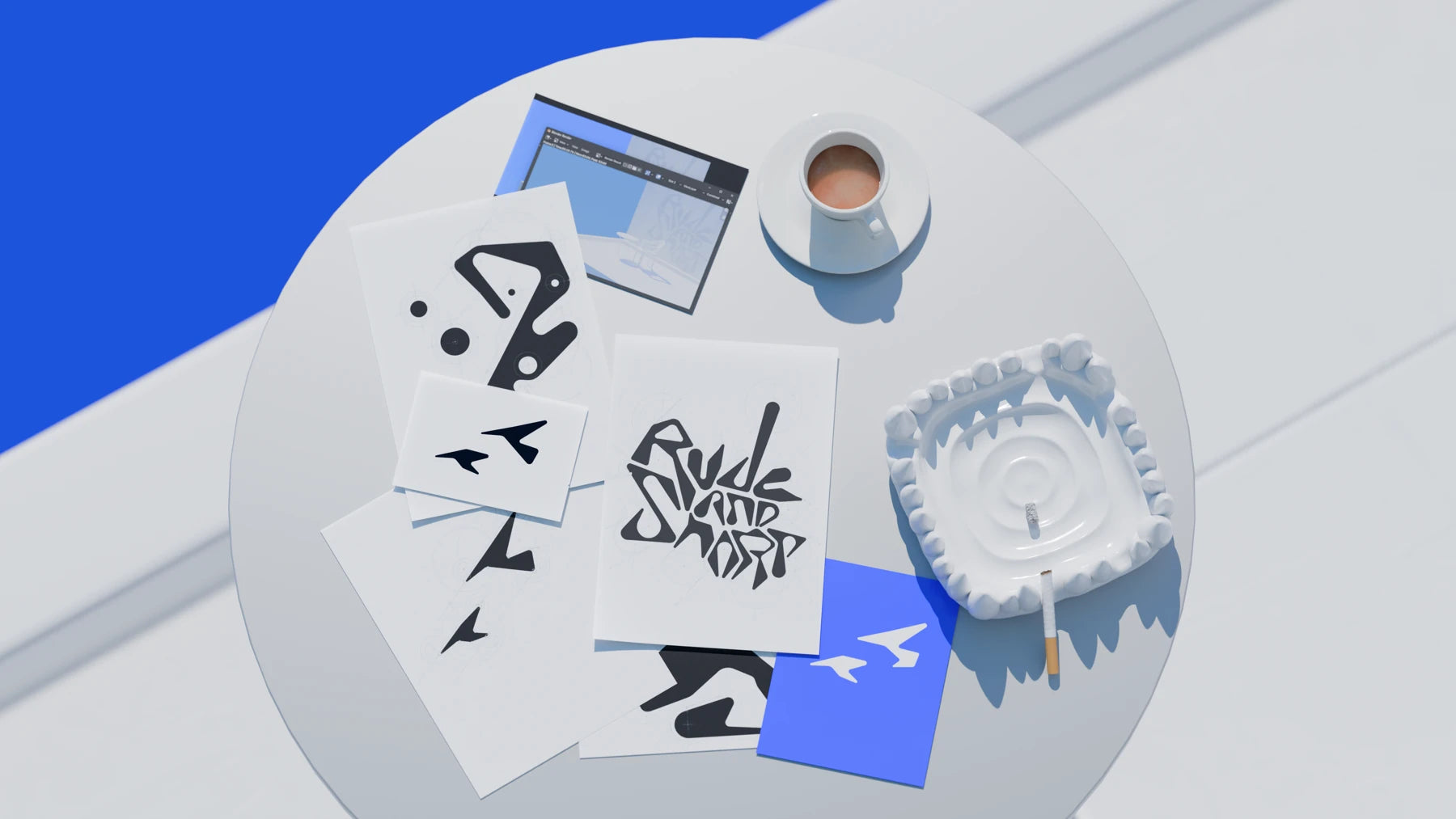 The Rude and Sharp tray, sketches and objects on a white table against a blue sky